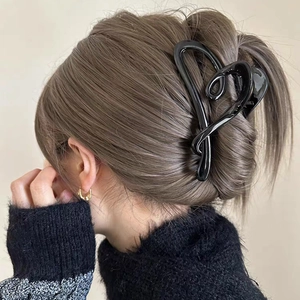 Glossy black heart-shaped hair claw clip for elegant Korean style high bun hairstyles