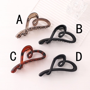 Matte irregular heart hair claw clips in leopard print and black for women