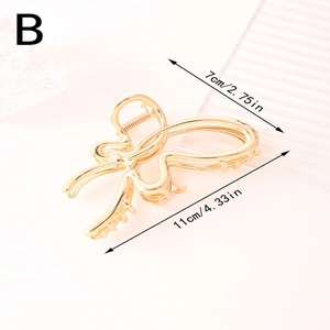 Elegant gold hollow butterfly hair claw clip with metallic finish for women hairstyles