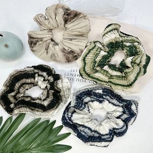 French vintage tie-dye silk scrunchies set in green, blue, and black marble patterns
