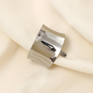 Polished silver alloy high ponytail holder hair cuff on beige silk background