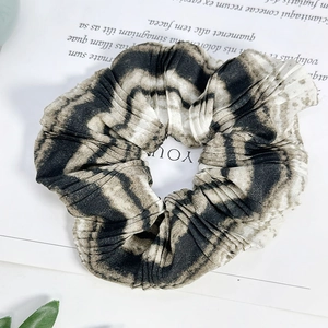 French vintage ink floral scrunchie with retro pleated fabric and tie-dye ripple pattern