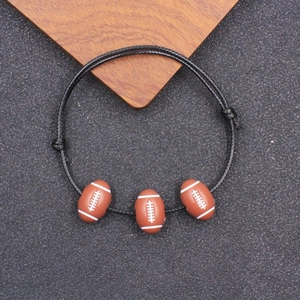 Bracciale intrecciato in cordino nero con tre ciondoli a forma di pallone da football americano