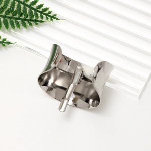 Polished silver metal hair cuff with securing pin shown on a modern decorative background