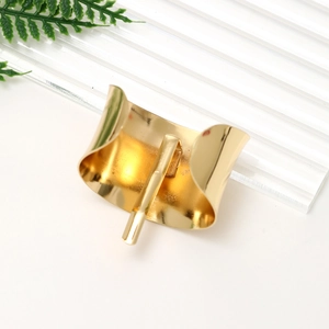 Elegant gold minimalist alloy ponytail hook hair clip accessory on a modern white surface
