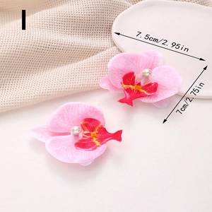Vue détaillée de la barrette orchidée rose avec dimensions et perle centrale