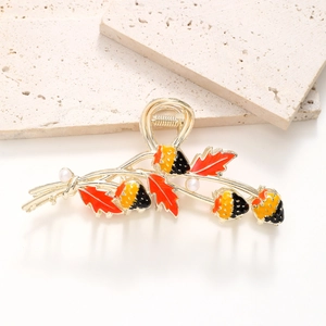 Golden alloy strawberry hair claw clip with red oil-drop leaves and white pearls