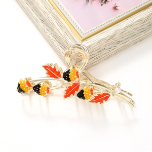 Golden alloy maple leaf and berry hair claw clip with enamel finish and white pearls