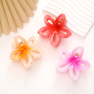 Lot de trois pinces à cheveux fleurs en acrylique coloré avec design évidé et ressorts dorés