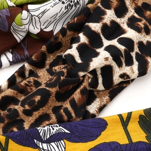 Fashionable sports headbands with leopard and floral patterns featuring a twist design