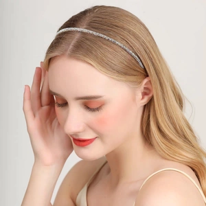 Detail of slim rhinestone headband with colorful crystals worn by a model