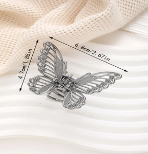Detailed view of silver butterfly claw clip dimensions with rhinestone accents