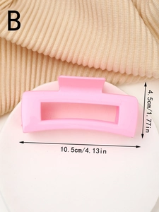 Detail view of a pink rectangular hair claw clip with size measurements 10.5cm by 4.5cm