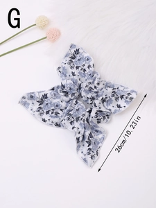 Detail of floral scrunchie showing the 26cm large bow size and delicate flower pattern