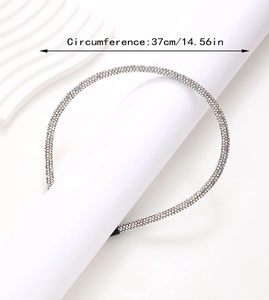 Detail showing a slim glittering rhinestone headband with a 37cm/14.56in circumference
