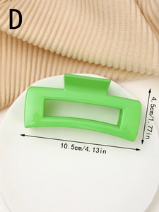 Detail showing bright green large claw clip with size dimensions 10.5cm and 4.5cm
