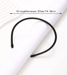 Detail shot of black rhinestone headband with 37cm circumference and protective soft rubber tips