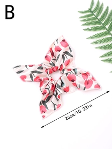 Detail view of 26cm large floral scrunchie with red tulip print on silk-like satin fabric