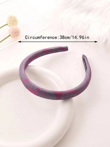 Detail of purple paisley satin headband featuring soft sponge padding and 38cm circumference