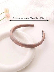 Detail of satin floral headband showing handmade label and 38cm circumference measurement