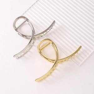 Minimalist metallic shark hair clips in gold and silver finish with cross streamlined design