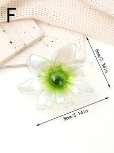 Vue détaillée de la pince à cheveux fleur de 8cm avec dégradé sur fond texturé beige