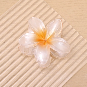 Elegant large pearlescent plumeria flower hair claw clip with warm orange gradient center