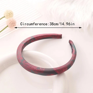 Elegant paisley satin headband with sponge padding and 38cm circumference detail
