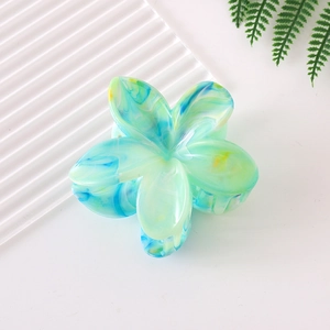 Frangipani hair claw clip with blue and yellow marble gradient effect flower design