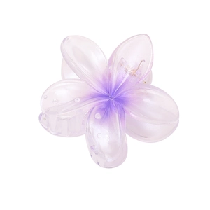 Close-up of purple gradient flower hair claw clip with pearlescent resin finish