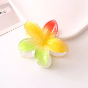 Gradient plumeria hair claw clip with vibrant tropical floral colors for elegant hairstyling