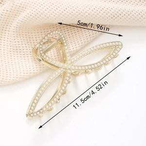 Detailed view of large gold rhinestone claw clip with pearls measuring 11.5cm by 5cm