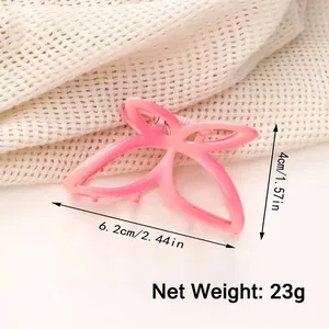 Pink butterfly hair claw clip with a matte gradient finish for elegant hairstyles