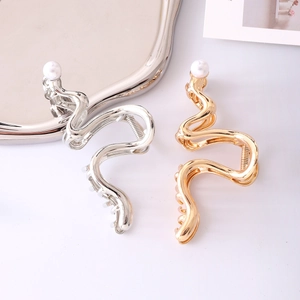 Elegant gold and silver wave-shaped metal hair claws with pearl accent for women
