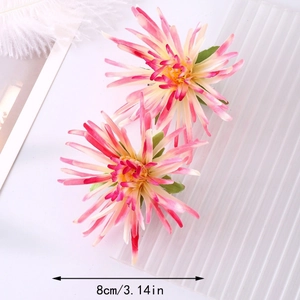 Macro detail of artificial pink chrysanthemum hair clip showing 8cm diameter and petals