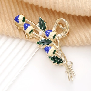 Elegant strawberry alloy hair claw clip with blue enamel and pearls on gold finish