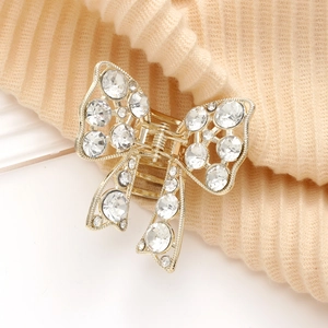Pince à cheveux papillon élégante en métal doré avec strass brillants et pampilles