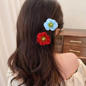 Floral fabric hair clips in red and blue colors shown from a side view for women