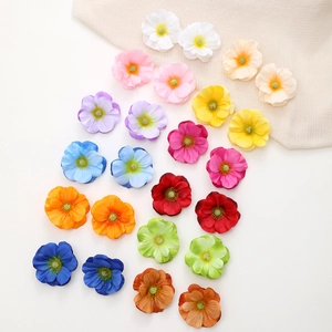 Detailed view of 24 pieces artificial silk fabric flowers in twelve gradient colors for DIY