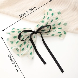 Elegant large white bow hair clip with green polka dots and black ribbon detail, 25cm size