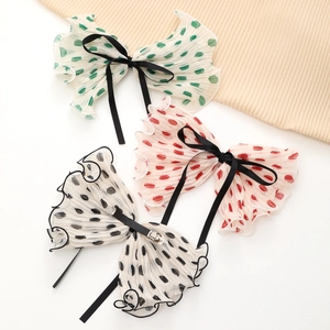 Polka dot pleated bow hair clips in red green and black with secure metal alligator base