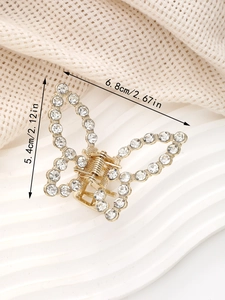 Vue détaillée de la pince à cheveux papillon strass avec dimensions 6,8cm par 5,4cm