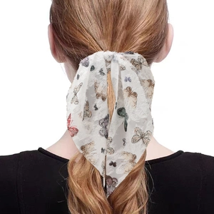 White butterfly print hair ribbon with lace trim tied on a woman's ponytail back view
