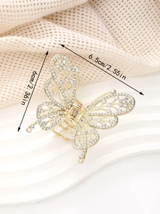 Détail de la pince à cheveux papillon dorée avec strass et cotes de dimensions