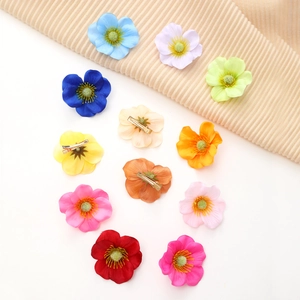 Detail shot of multi-colored fabric flower hair clips set in a circular layout
