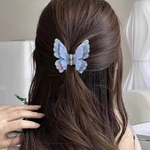 Sparkling light blue butterfly hair claw clip with rhinestones for elegant hair styling
