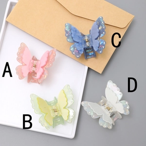 Elegant butterfly hair clips with sparkling rhinestones in four soft pastel colors
