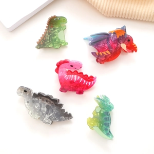 Set di cinque mollette per capelli a forma di dinosauro in acrilico colorato per donna