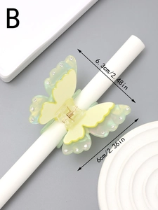 Detail of butterfly hair claw with rhinestones and size dimensions 6.3cm by 6cm