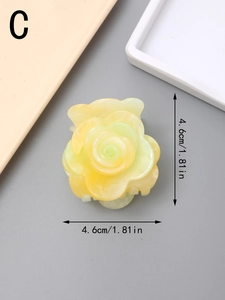 Top view of a 4.6cm acetate rose hair claw clip in pale yellow with fine golden glitter detail